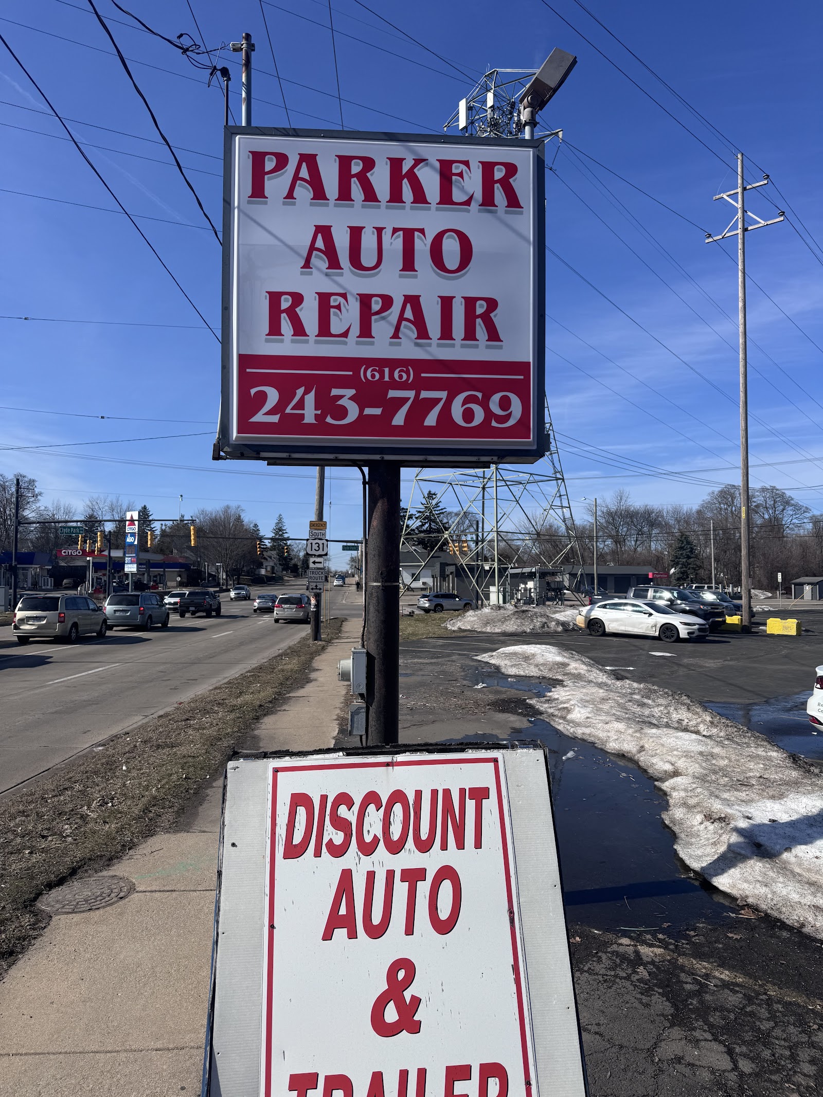 Parker Auto Repair roadside sign on Burton Street, (616) 243-7769